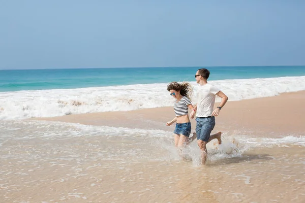 Portrait of lovely couple in love having fun on the beach. Young beautiful people hugging . Romantic moment. Valentine's day. Honey moon.