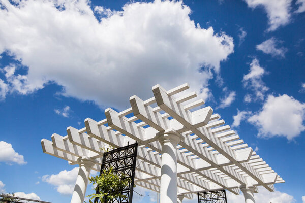 Peaceful gazebo set in the shade of a mature garden