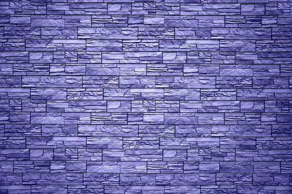 Hintergrund der blauen Ziegel. Mauer aus blauen Ziegeln. Die Textur der Mauer. Textur der blauen dekorativen Fliesen in Form von Ziegeln. — Stockfoto