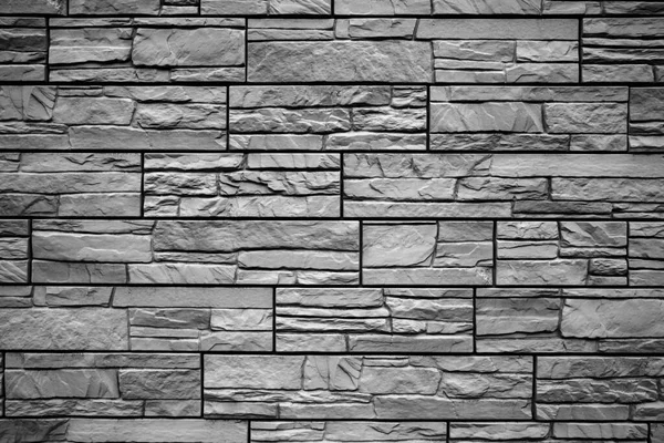 Zwart-witte bakstenen muur achtergrond. Detail van een zwart-witte bakstenen muur textuur. — Stockfoto