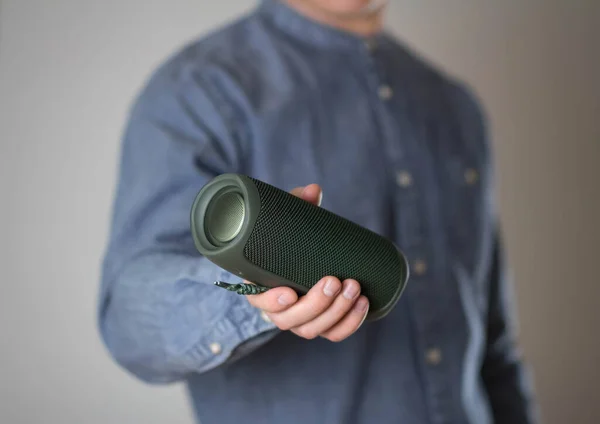 Man Holds Portable Speaker Close — Stock Photo, Image