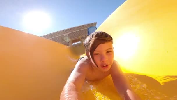 Boy Yellow Water Slide Children Rejoice Going Water Slide Fun — Stockvideo