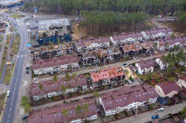Top view of the destroyed and burnt houses. Houses were destroyed by rockets or mines from Russian soldiers. Cities of Ukraine after the Russian occupation.