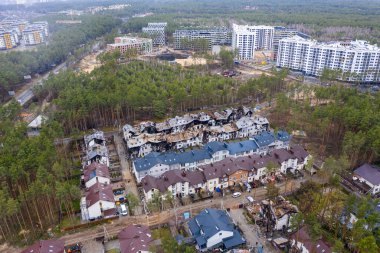 Top view of the destroyed and burnt houses. Houses were destroyed by rockets or mines from Russian soldiers. Cities of Ukraine after the Russian occupation.
