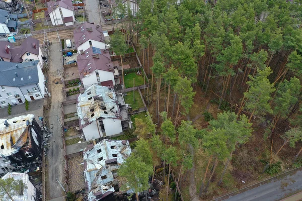 Top view of the destroyed and burnt houses. Houses were destroyed by rockets or mines from Russian soldiers. Cities of Ukraine after the Russian occupation.