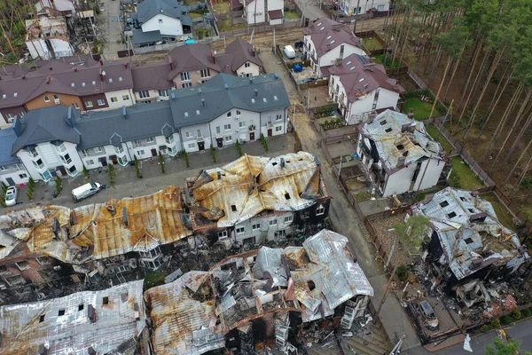 Top view of the destroyed and burnt houses. Houses were destroyed by rockets or mines from Russian soldiers. Cities of Ukraine after the Russian occupation.