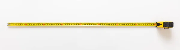 Zmierzyć Taśmę Izolowaną Białym Tle Metalowy Metr Długi Żółty Kolor — Zdjęcie stockowe