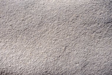 Granit gri kayalar, deniz tuzu ve rüzgar arka plan dokusu ile şekillenir. Sert mineral eskitilmiş malzeme yüzeyi, Kolymbithres Paros Adası Yunanistan.