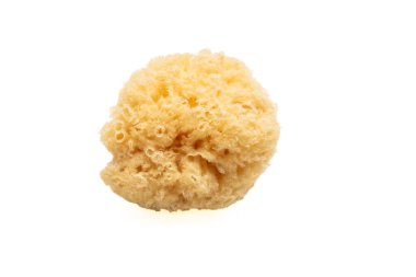 Natural sponge isolated cutout on white background. Yellow color accessory for bath, face cleaning and body care
