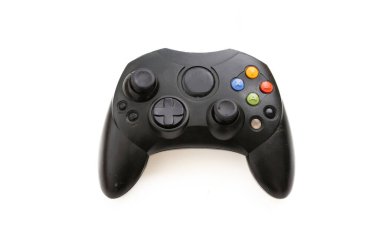 Video game controller isolated on white background. Overhead gaming console control, black color, wireless.