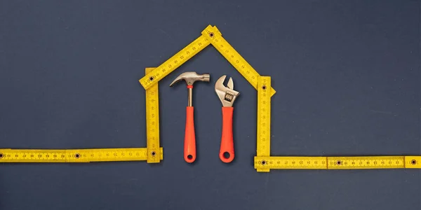 Home Repair Hand Tools House Shape Yellow Wooden Measure Blue — Stock Photo, Image