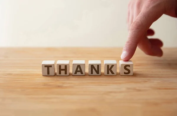 Thanks Concept Word Thanks Wooden Cube Finger Shows Letter Message — Stockfoto