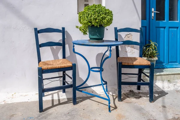 Empty Blue Metal Table Two Wooden Chairs White Traditional Building — 스톡 사진
