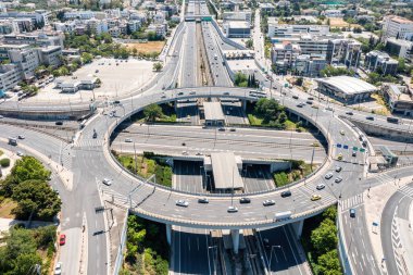 Attiki Odos toll road motorway interchange with Kifisias Avenue in Marousi Attica, Athens, Greece. Aerial drone view of multilevel junction ring road clipart