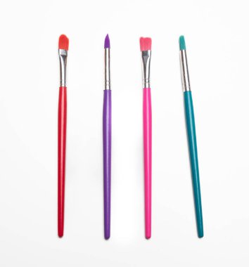 Paint brush set isolated cutout on white background. Painter equipment, colorful paintbrush, art and creativity