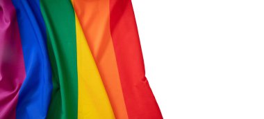 Gökkuşağı renkleri tekstil kırışıklıkları, beyaz arka planda dalgalanmalar olan renkli kumaş, kopyalama alanı. LGBT Gay gurur şablonu, üst görünüm, afiş.