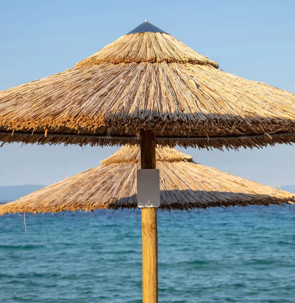 Straw Beach Umbrellas Close Sunny Day Sea Blue Sky Ocean — Stock Photo, Image
