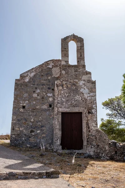 Saint John Baptist, Kastro Kythira Ionian islands, destination Greece. Old abandoned Orthodox stonewall church at Venetian Castle or Fortezza. Vertical