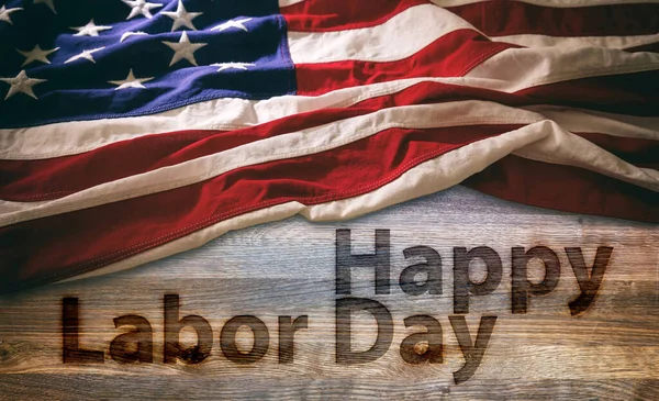 Happy Labor Day and USA Flag on wooden background, above view. Federal US America holiday celebration