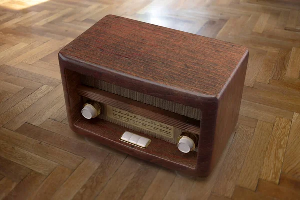Nostalgia concept. Retro radio on wooden floor background. Vintage old fashioned brown radio for music, news, broadcast. Overhead view. 3d render