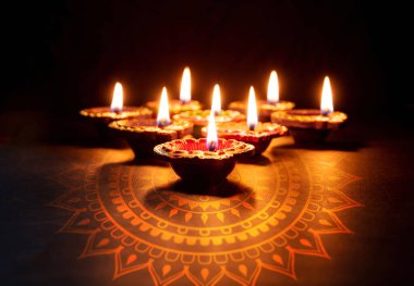 Happy Diwali. Deepavali Hindu festival of lights celebration. Clay diya candle. Oil lamp lit, copy spac