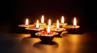 Happy Diwali. Deepavali Hindu festival of lights celebration. Clay diya candle. Oil lamp lit, copy spac