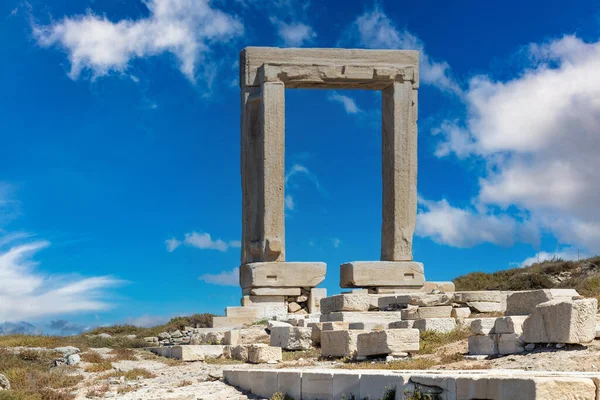 Naxos island, Greece. Temple of Apollo, Portara, Cyclades. Marble pillars gate, Landmark archeology destination.