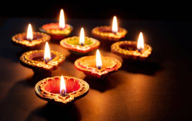 Happy Diwali. Deepavali Hindu festival of lights celebration. Clay diya candle. Oil lamp lit, copy spac