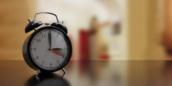 Fall Back Time. Daylight Saving End. Black alarm clock, one hour back change, blur background. 3d rende
