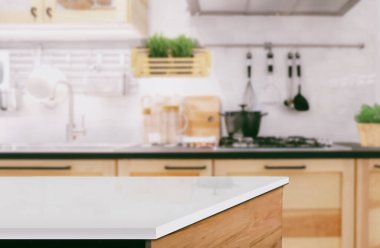 White marble texture table top on blurred kitchen background for montage or display your products.	