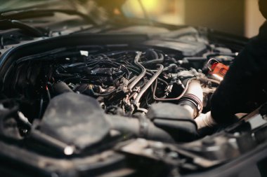 car repair concept, open hood in car service, wiring repair.