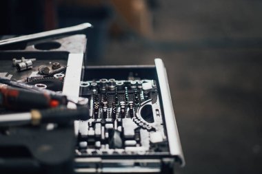 set of tools in a car service, the concept of fixing a car in a garage.