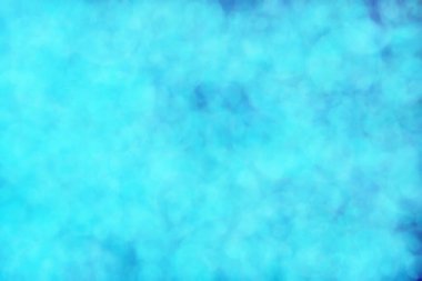 Bokeh ile soyut bir arkaplan. Yumuşak ışık odaklı noktalar.