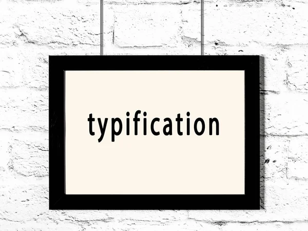 Black Wooden Frame Inscription Typification Hanging White Brick Wall — Stock Photo, Image