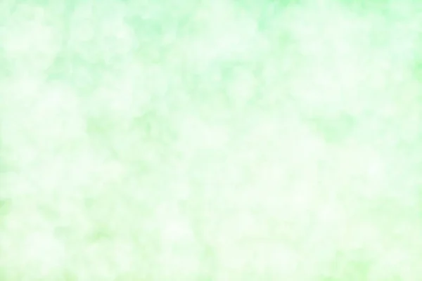 薄い緑の抽象的な背景と円の形のボケのスポット — ストック写真