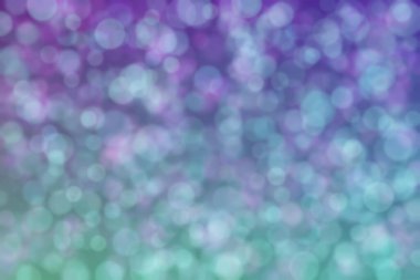 Çember şekilli bokeh benekli mor ve yeşil soyut odaklı arkaplan
