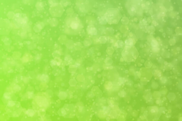 green abstract defocused background with hexagon shape bokeh spots
