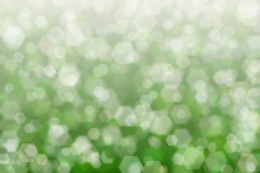 yeşil ve bej soyutlanmış arkaplan altıgen şekilli bokeh benekleri ile odaklanmış