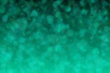 Yeşil ve mavi renkli ve daire şeklindeki desenlere sahip soyut ve güzel harmonik arkaplan.