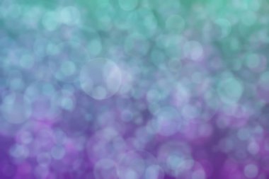 Mor ve yeşil arkaplanda daire şeklinde benekleri olan harmonik güzel astrakt arkaplan.