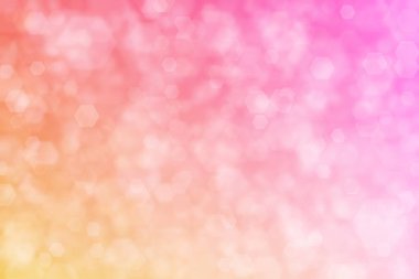 Pembe ve turuncu soyutlanmış arkaplan, altıgen şekilli bokeh noktaları.