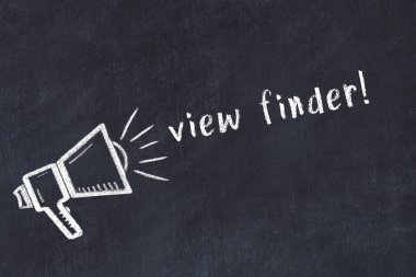 Black chalkboard with drawing of a loudspeaker and inscription view finder