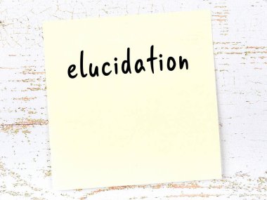 Concept of reminder about elucidation. Yellow sticky sheet of paper on wooden wall with inscription