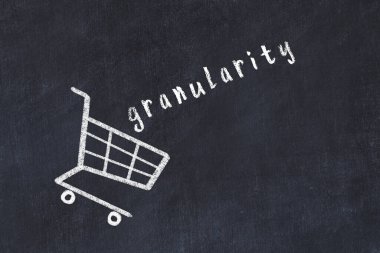 Chalk drawing of shopping cart and word granularity on black chalboard. Concept of globalization and mass consuming.