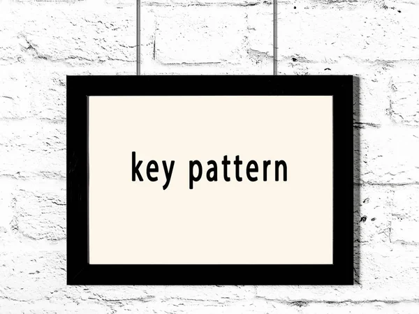 Black Wooden Frame Inscription Key Pattern Hanging White Brick Wall — Zdjęcie stockowe