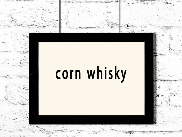 Black Wooden Frame Inscription Corn Whisky Hanging White Brick Wall — стоковое фото