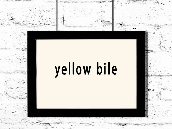 Black Wooden Frame Inscription Yellow Bile Hanging White Brick Wall — 스톡 사진