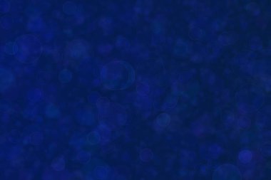 Bokeh ile soyut bir arkaplan. Yumuşak ışık odaklı noktalar.