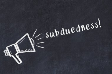 Black chalkboard with drawing of a loudspeaker and inscription subduedness