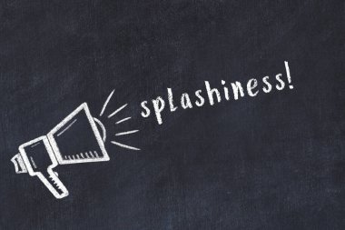 Chalk drawing of loudspeaker and handwritten inscription splashiness on black desk